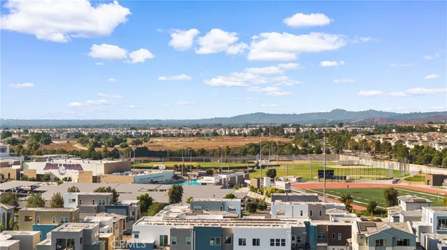 a view of a garden with a building in the background