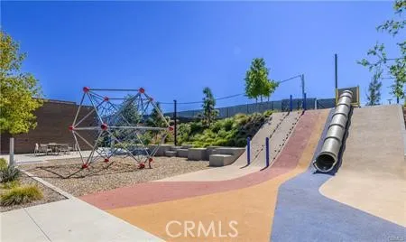 an aerial view of a house outdoor space and swimming pool