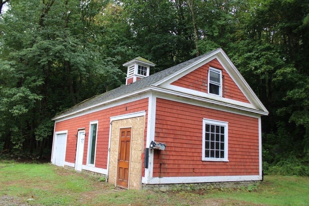 321 Easthampton Road Northampton, MA 01062 - Photo 6 of 15 a front view of a house with a yard