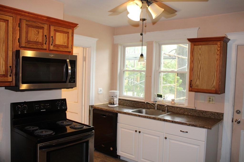321 Easthampton Road Northampton, MA 01062 - Photo 7 of 15 a kitchen with a sink stove and microwave