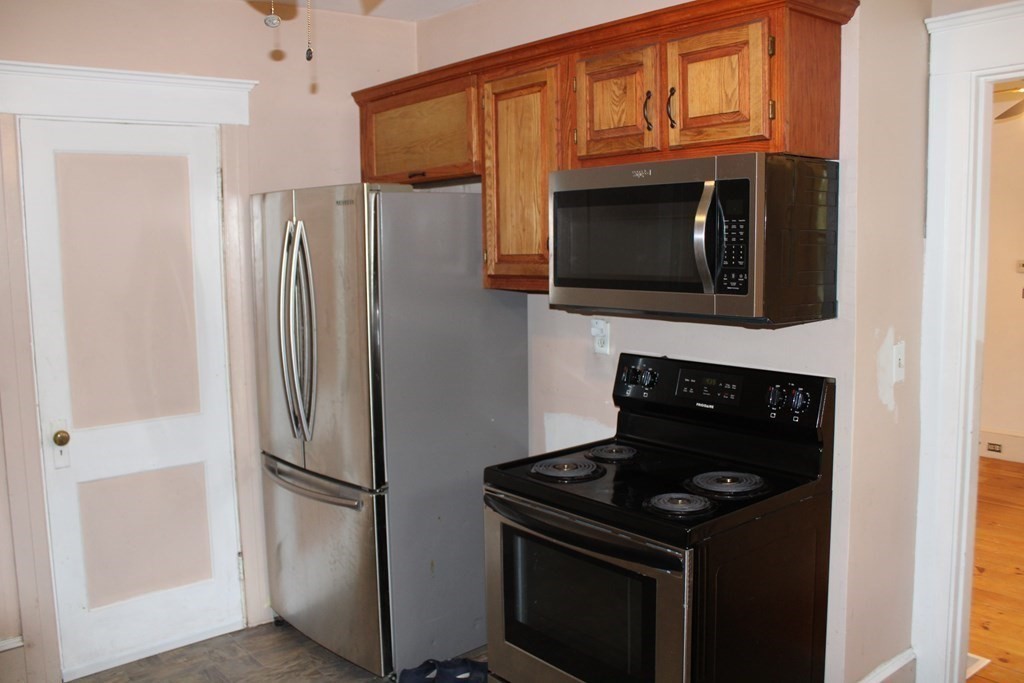 321 Easthampton Road Northampton, MA 01062 - Photo 8 of 15 a kitchen with a refrigerator stove and microwave