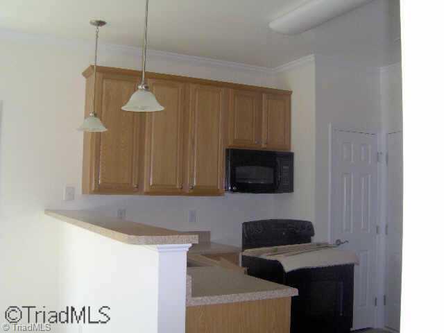 190 Everidge Road Winston-Salem, NC 27103 - Photo 4 of 9 Other. Open Kitchen w/Bar Top, Black Appls, 42 Cabinets, Pendant Lites Breakfast Nook, Pantry, Garage Entrance, sliding patio door, & double patio