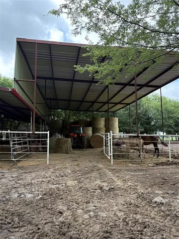 a view of outdoor space with deck and white umbrellas