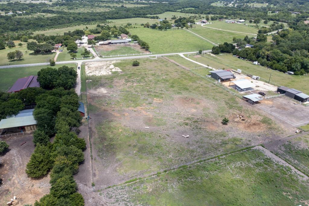 Tbd Palmyra Road Palmer, TX 75152 - Photo 3 of 31 an aerial view of a house with a yard and lake view