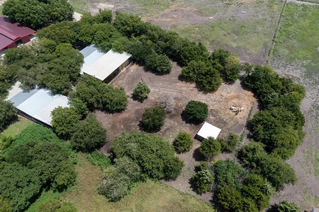 an aerial view of a houses with outdoor space