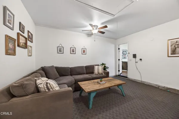 a living room with furniture and a window