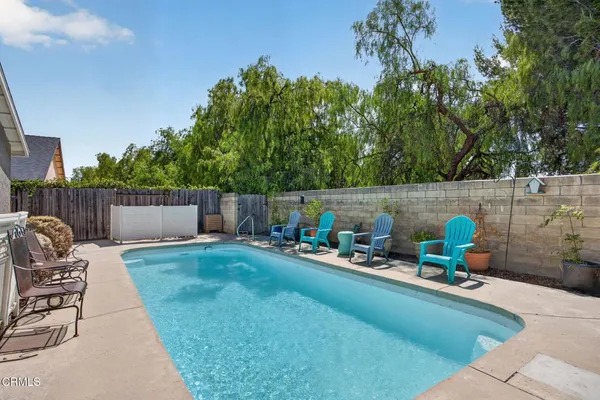 a view of a backyard with sitting area