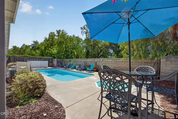 a view of an outdoor sitting area with furniture