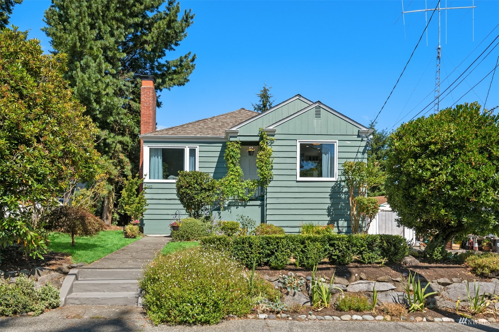 3912 Southwest Holden Street Seattle, WA 98136 - Photo 1 of 27 a front view of a house with a yard
