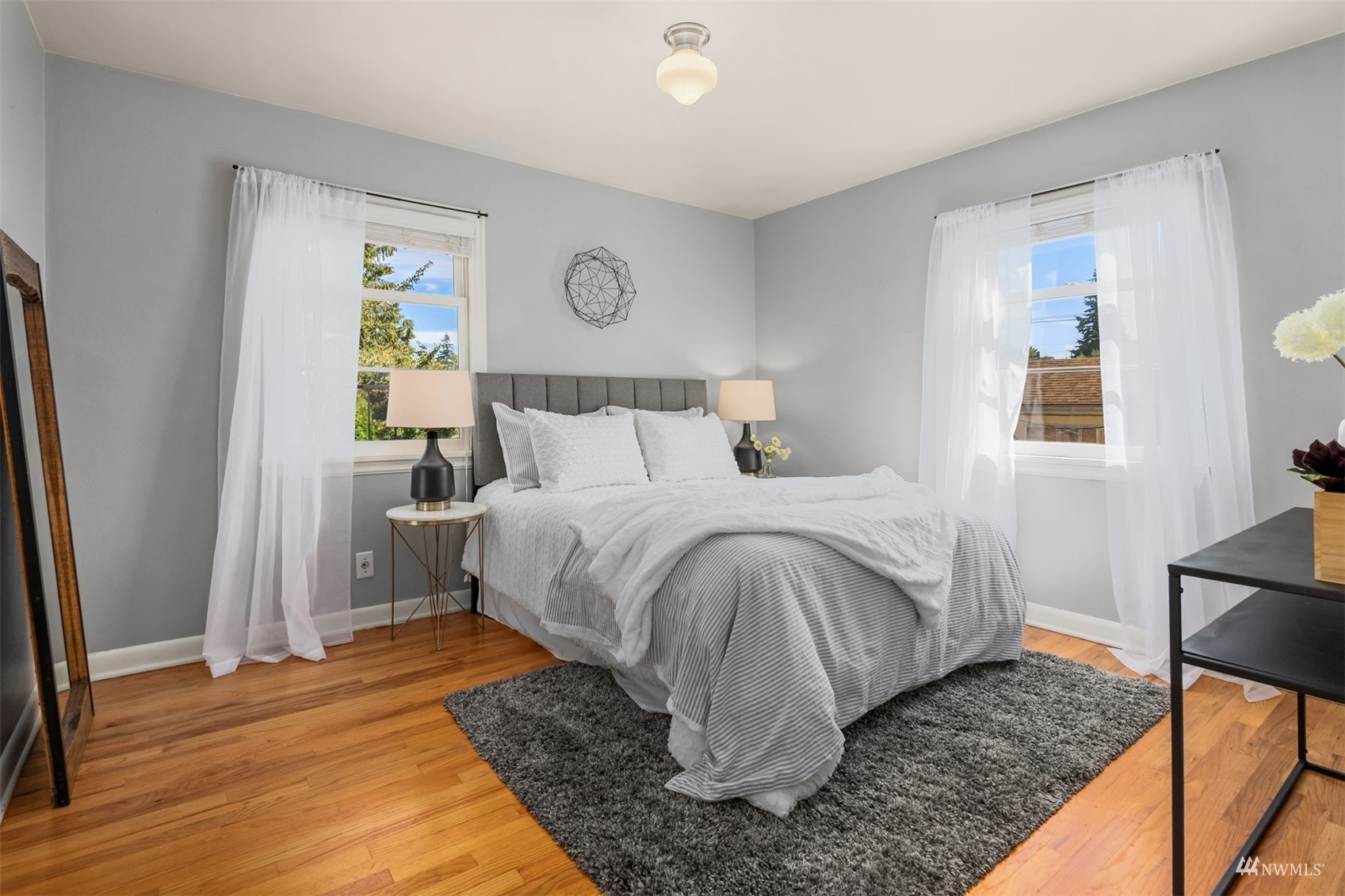 3912 Southwest Holden Street Seattle, WA 98136 - Photo 12 of 27 a bedroom with a bed and a window