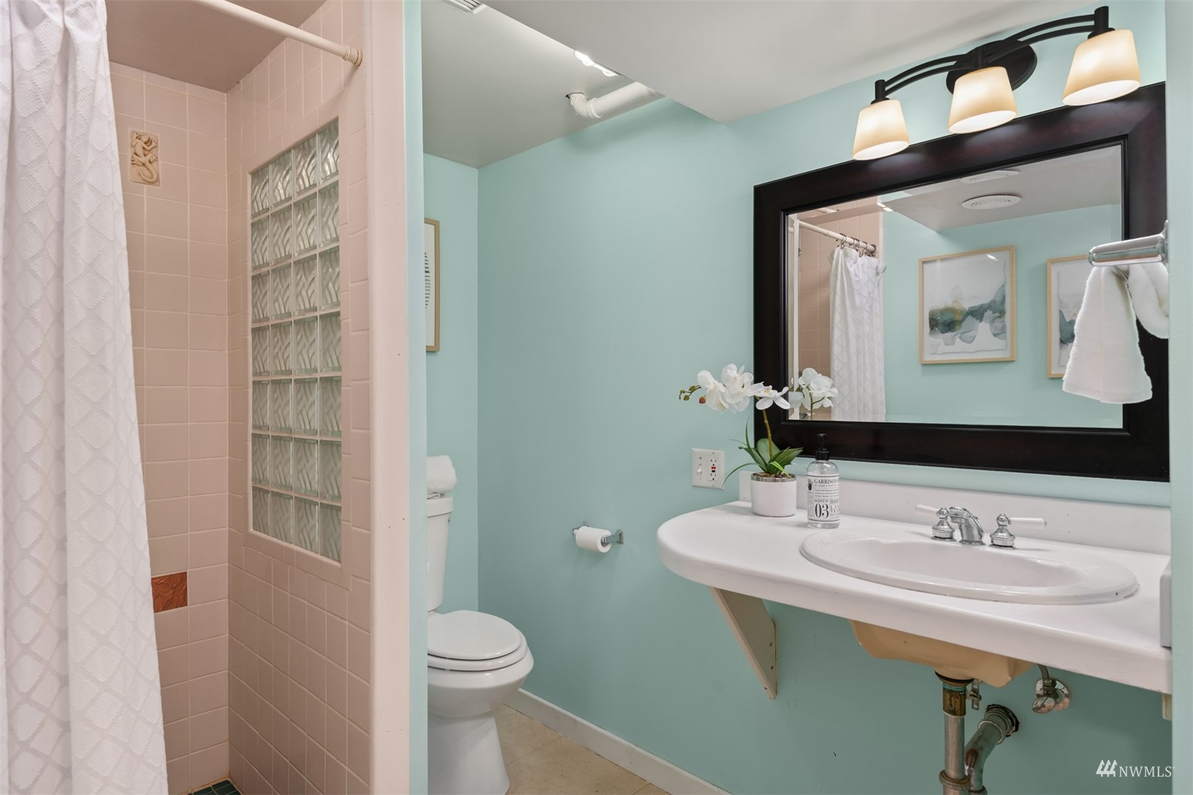 3912 Southwest Holden Street Seattle, WA 98136 - Photo 18 of 27 a bathroom with a sink toilet and shower