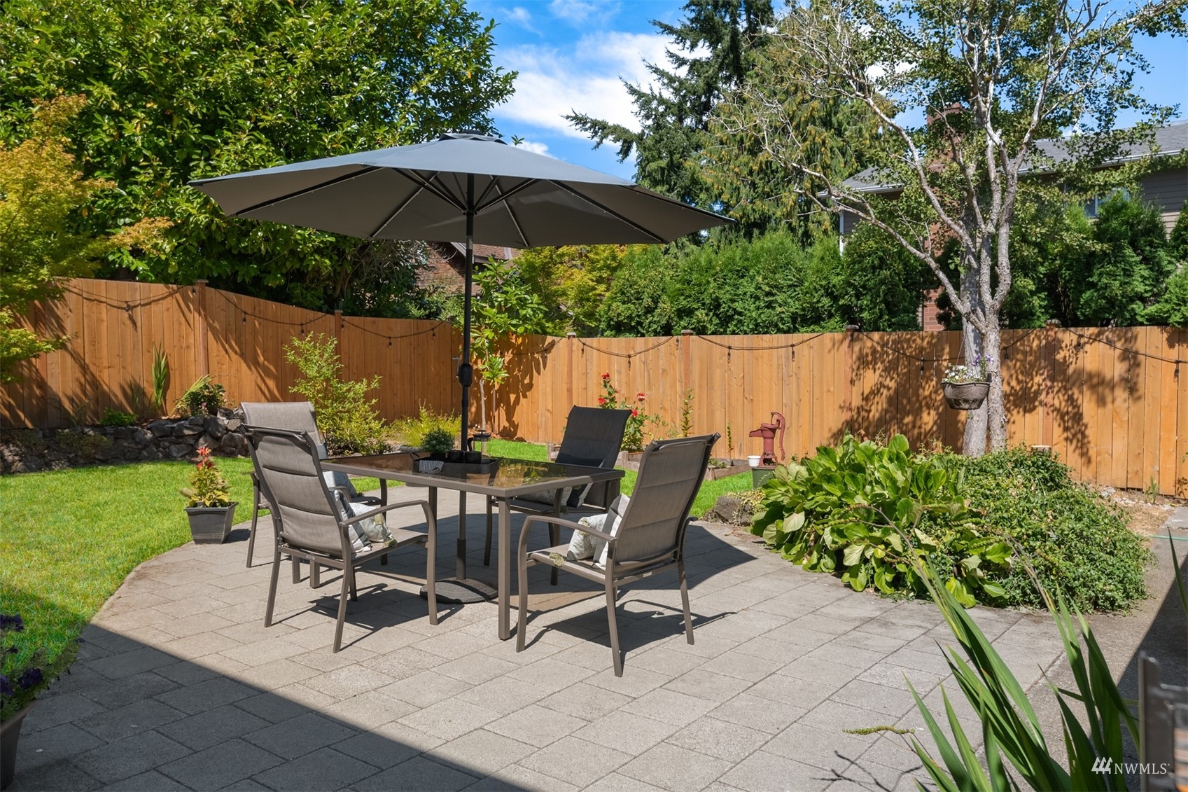 3912 Southwest Holden Street Seattle, WA 98136 - Photo 24 of 27 a view of backyard with seating space and trees
