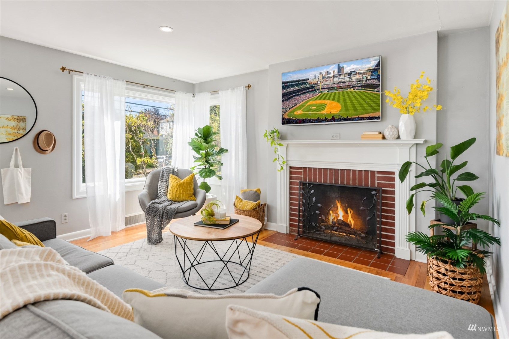 3912 Southwest Holden Street Seattle, WA 98136 - Photo 4 of 27 a living room with furniture fireplace and potted plants