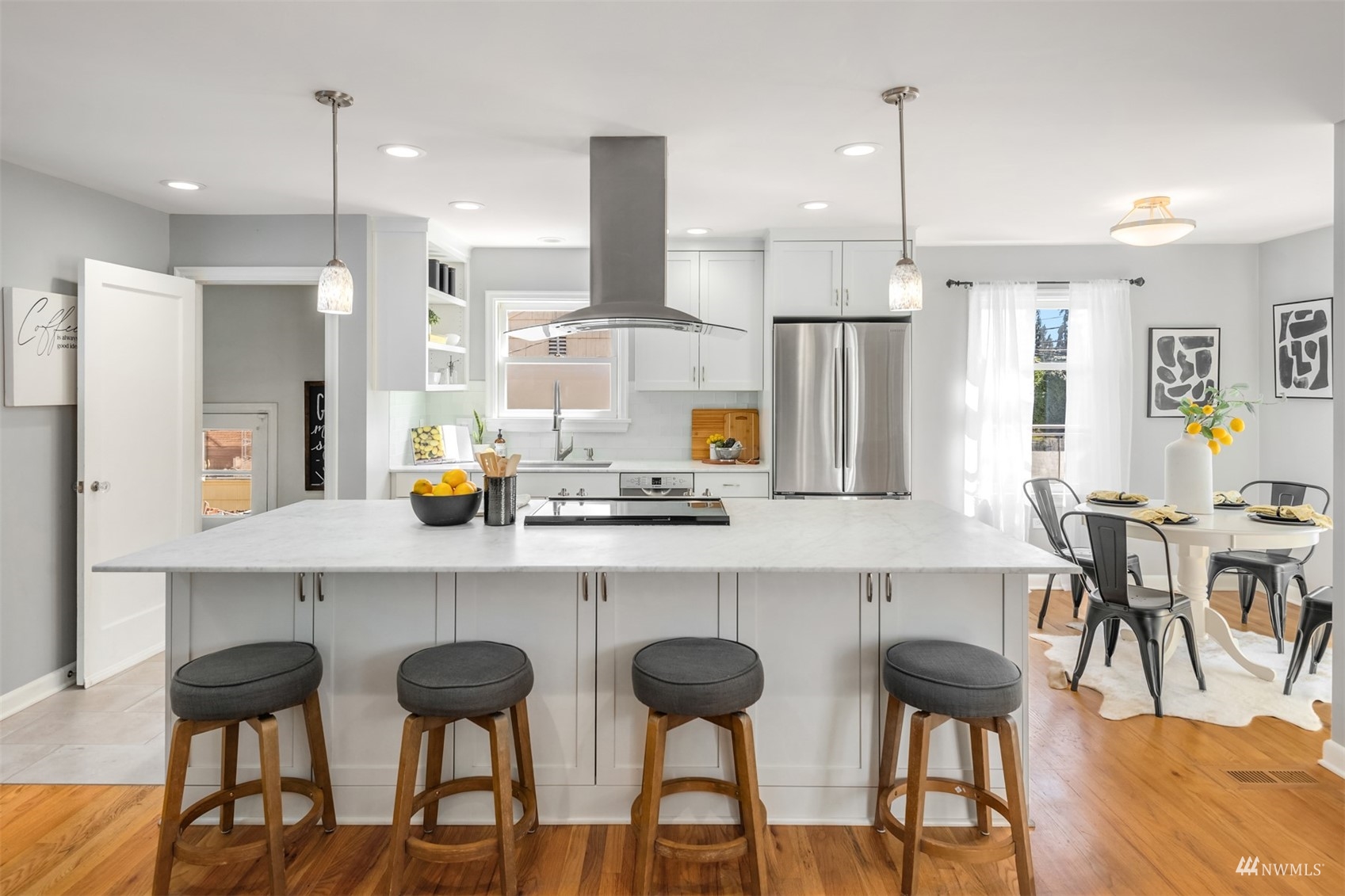 3912 Southwest Holden Street Seattle, WA 98136 - Photo 7 of 27 a kitchen with cabinets and chairs