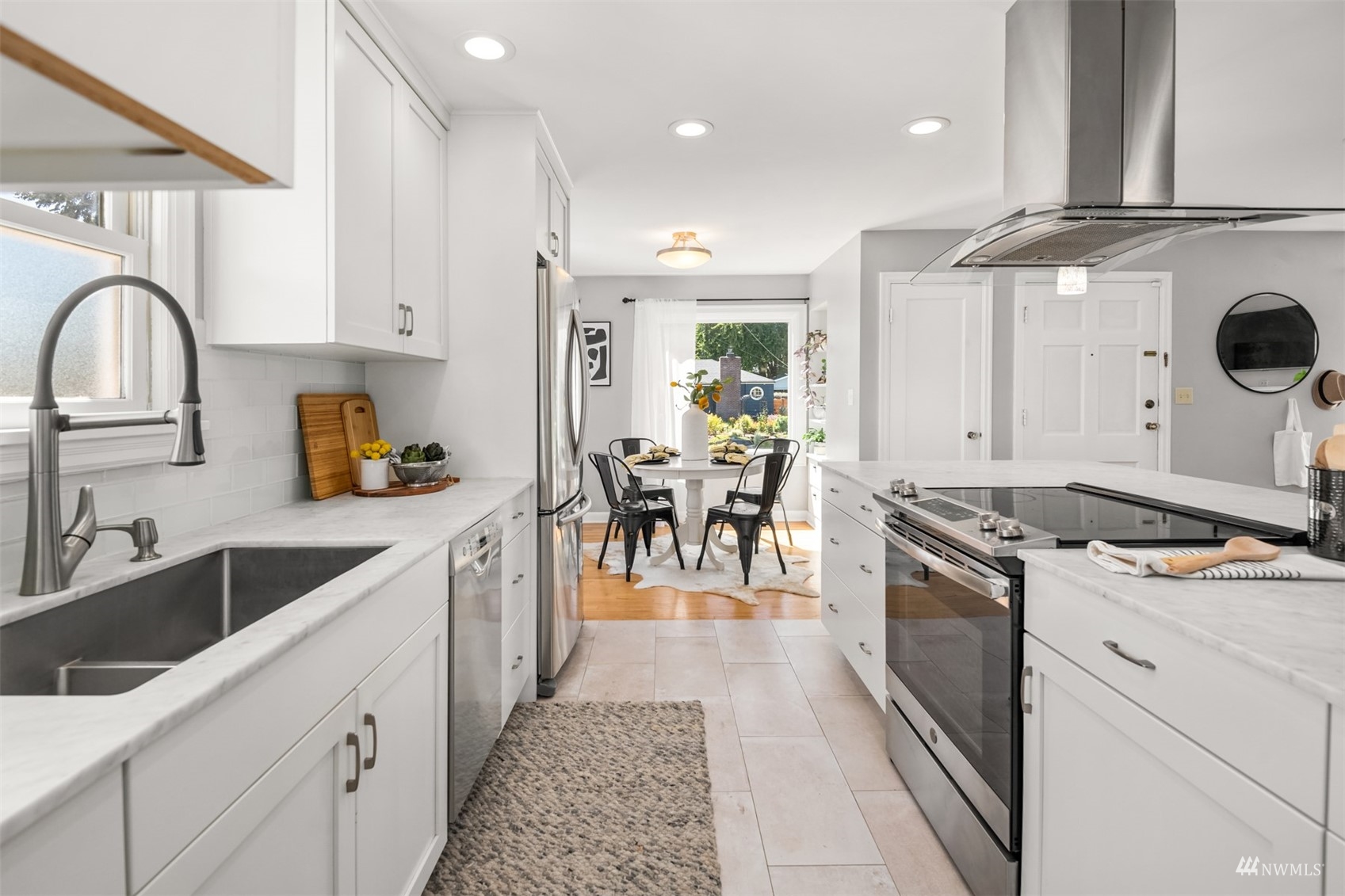 3912 Southwest Holden Street Seattle, WA 98136 - Photo 8 of 27 a kitchen with a stove oven and sink