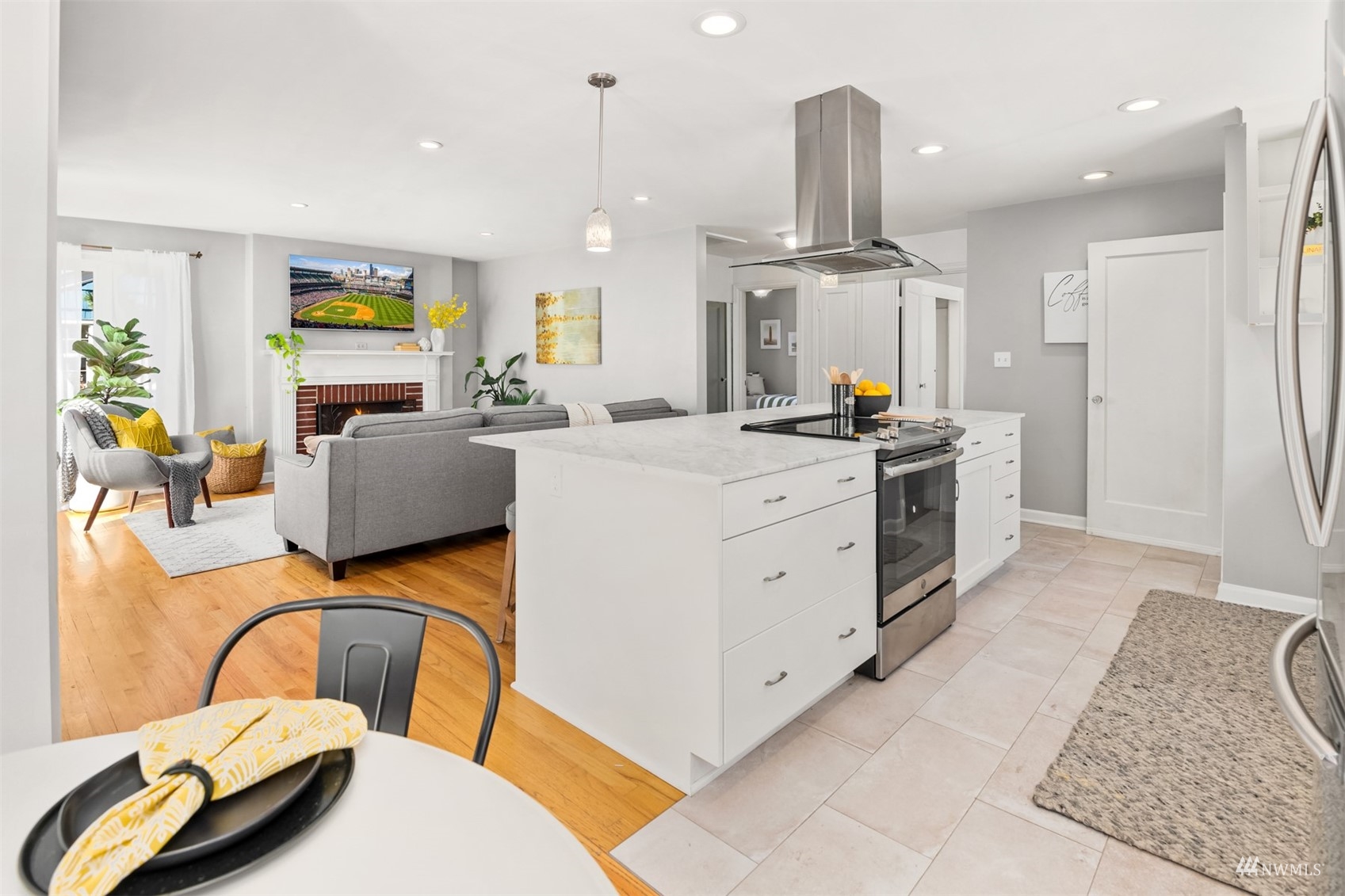 3912 Southwest Holden Street Seattle, WA 98136 - Photo 9 of 27 a view of a kitchen with furniture and a ceiling fan