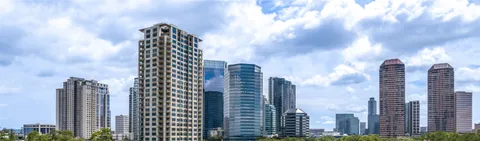 a view of a city with tall buildings