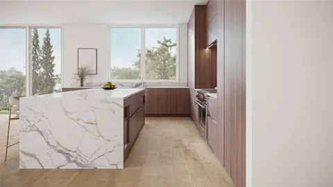 a kitchen with a wooden cabinets and table chair