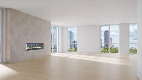 a en suite bathroom with a granite countertop sink and a mirror