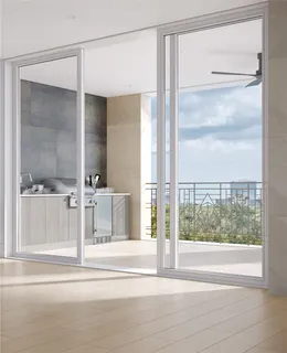 a view of an empty room with a window and fireplace