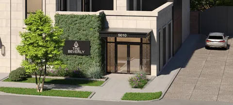 a large bathroom with a tub a sink and a mirror
