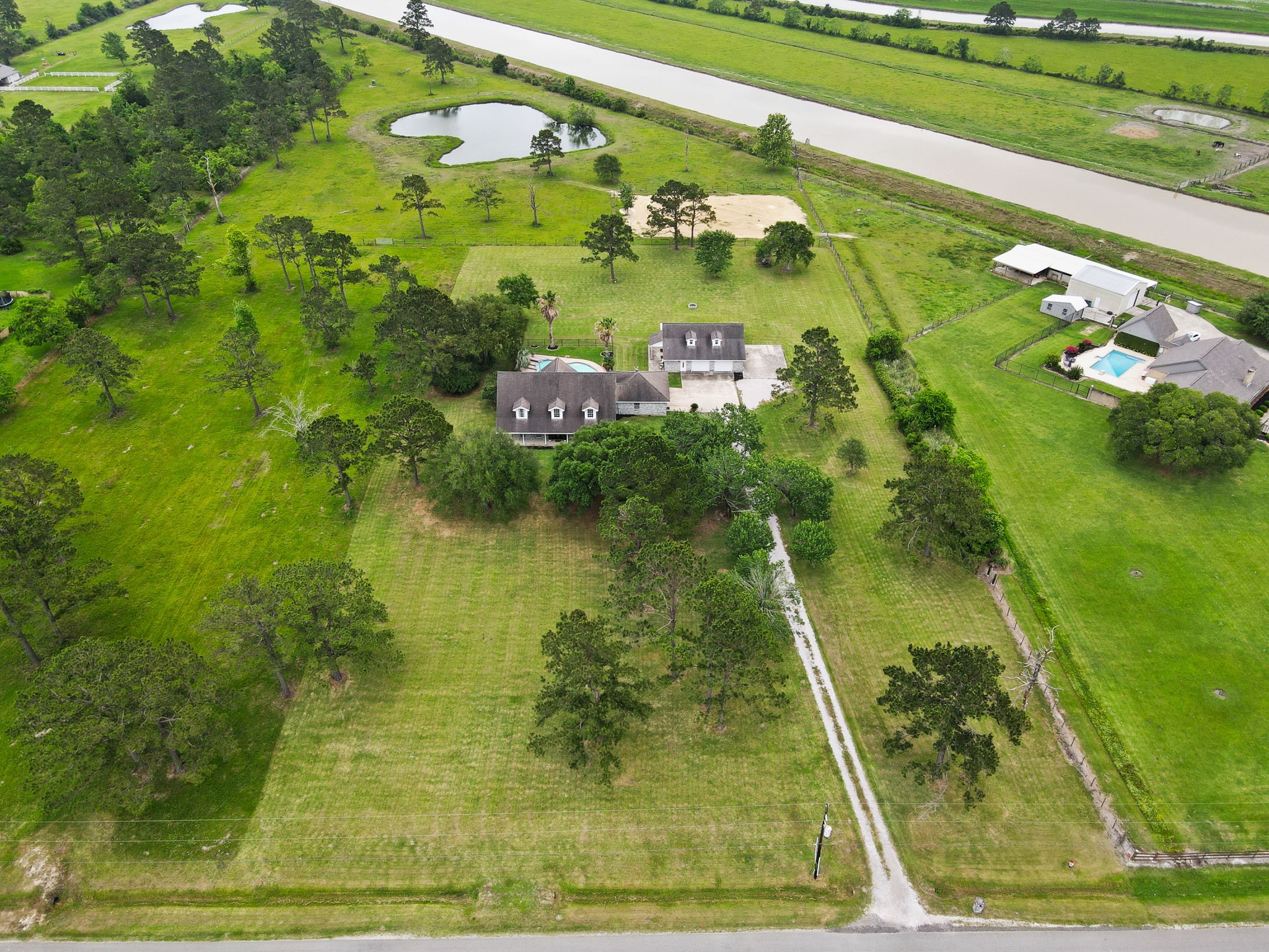 16421 Westbury Road Beaumont, TX 77713 - Photo 26 of 29 a view of a swimming pool with a yard