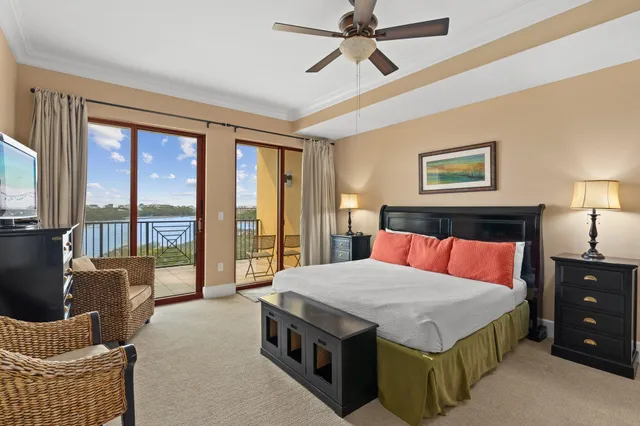 a bedroom with a bed and glass walk in closet