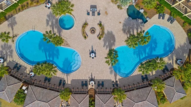 aerial view of a house with swimming pool and outdoor seating