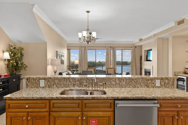 a view of a granite counter top a sink and a window