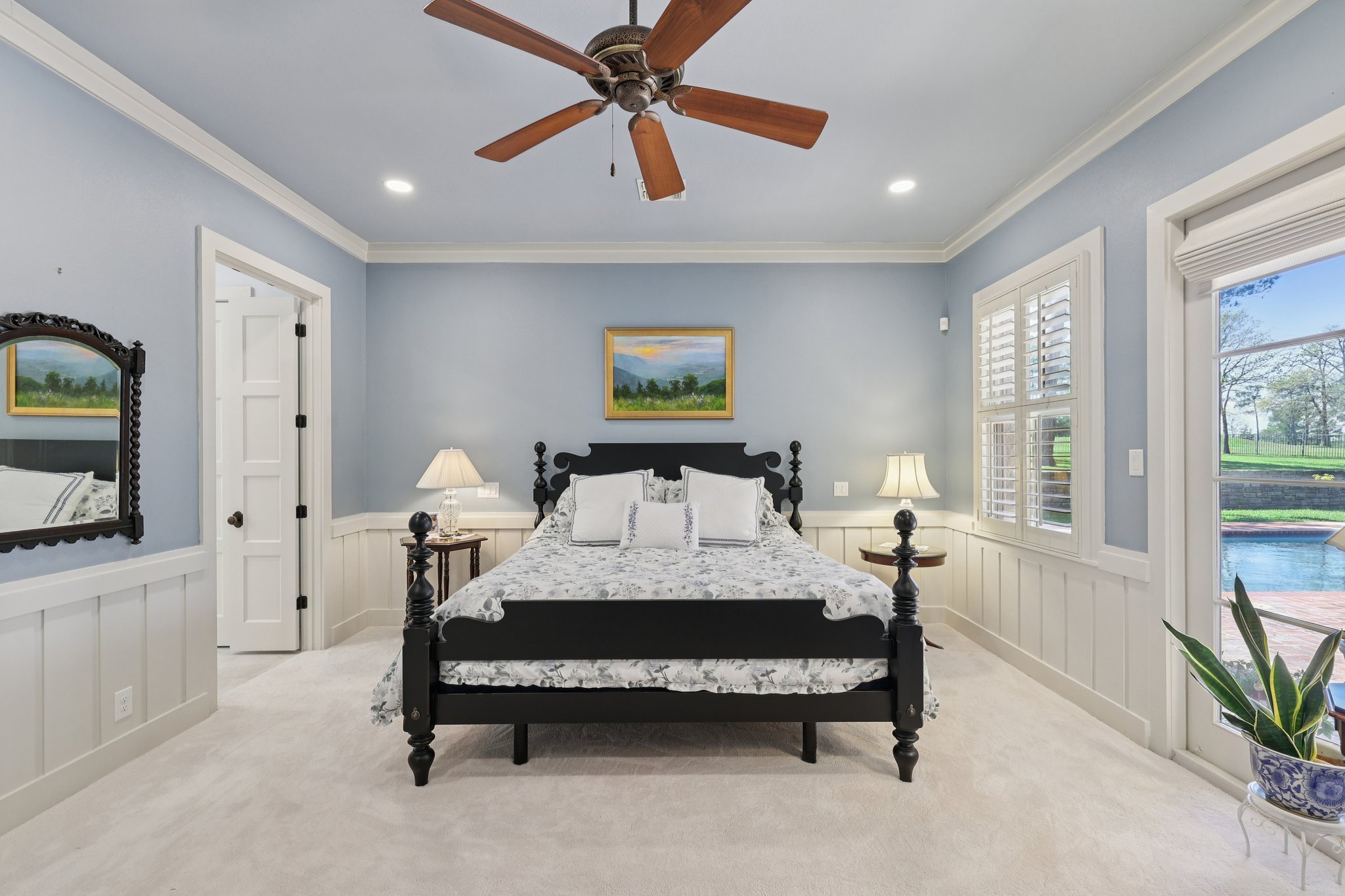 546 McAllister Road Bastrop, TX 78602 - Photo 16 of 40 Bedroom featuring a wainscoted wall, a decorative wall, ornamental molding, a ceiling fan, and recessed lighting