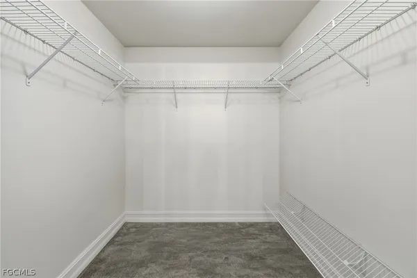 a view of a room with shelf on the wall