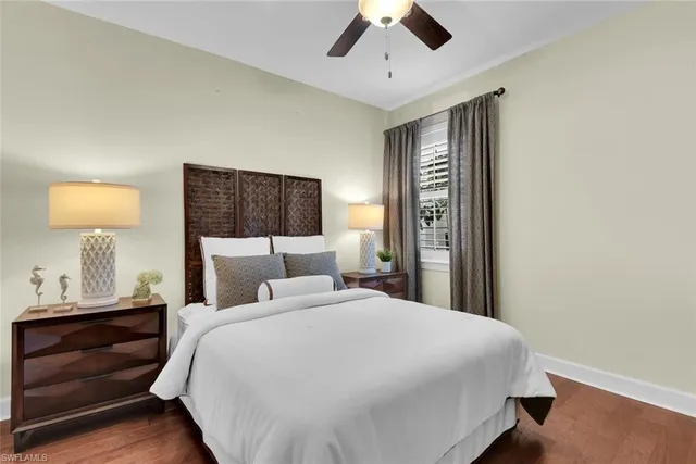 a bedroom with a bed and a lamp on table