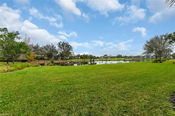 a view of outdoor space with playground and green space