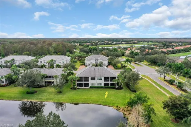 an aerial view of a house with outdoor space and street view