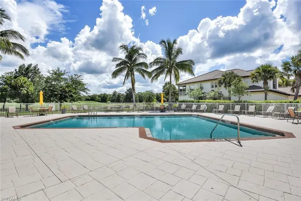 a view of swimming pool with outdoor seating