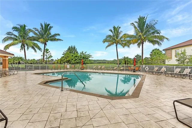 a view of swimming pool with chairs