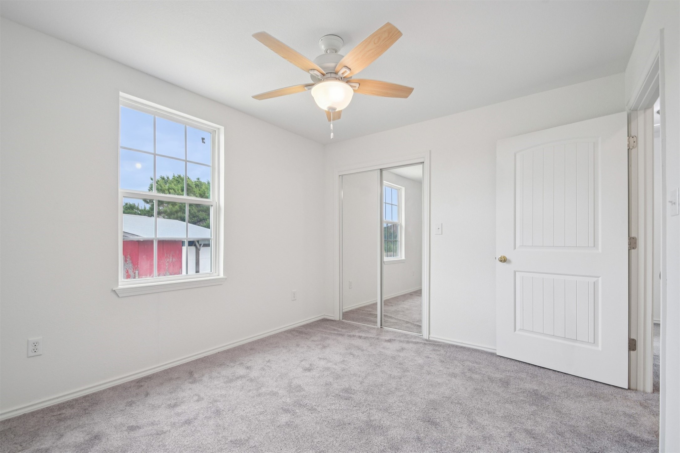 1470 Oak Grove Road Leander, TX 78641 - Photo 21 of 38 an empty room with windows and ceiling fan