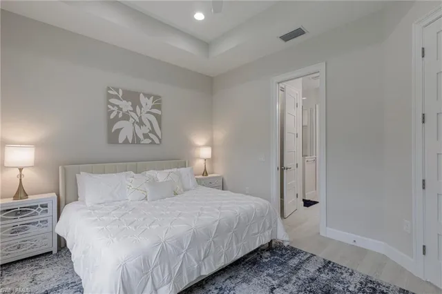 a bedroom with furniture and a window