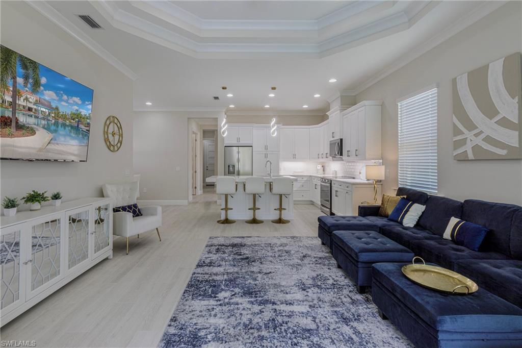 8909 Yucatan Court Naples, FL 34113 - Photo 6 of 36 a living room with furniture and a couch