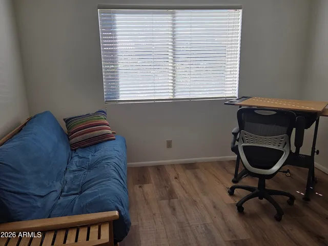 a workspace with furniture and a window