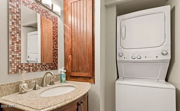 a bathroom with a sink toilet and a mirror