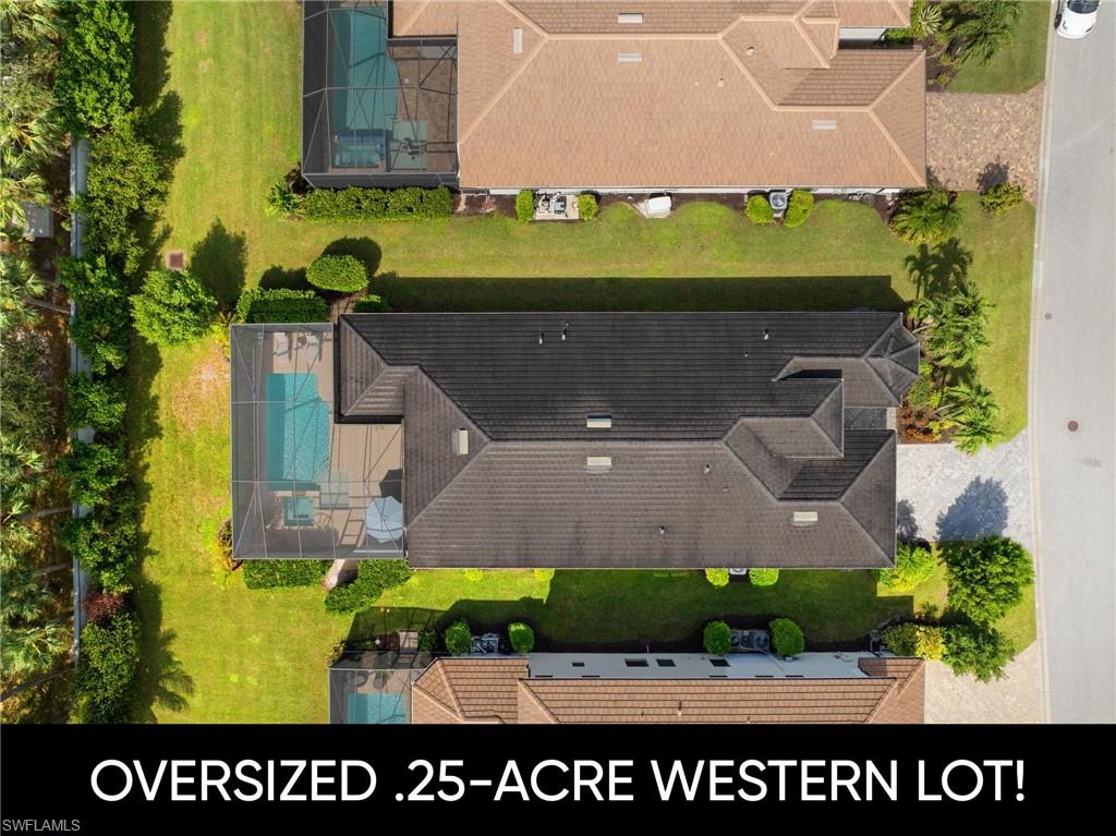 10067 Palazzo Drive Naples, FL 34119 - Photo 3 of 46 an aerial view of a building with garden