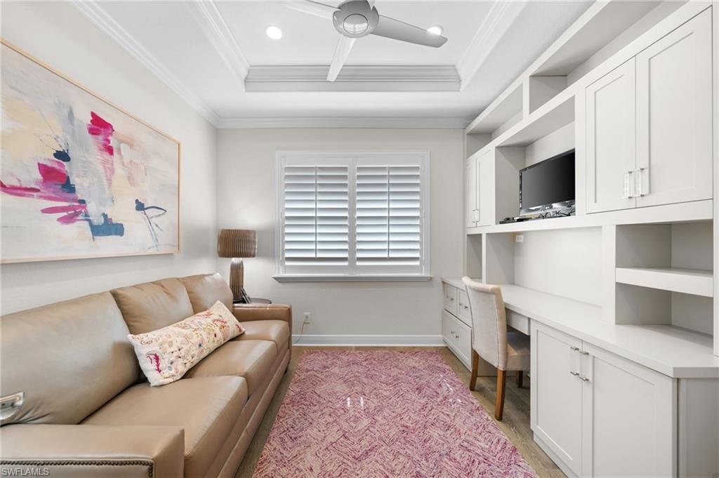 10067 Palazzo Drive Naples, FL 34119 - Photo 31 of 46 a living room with furniture and a window