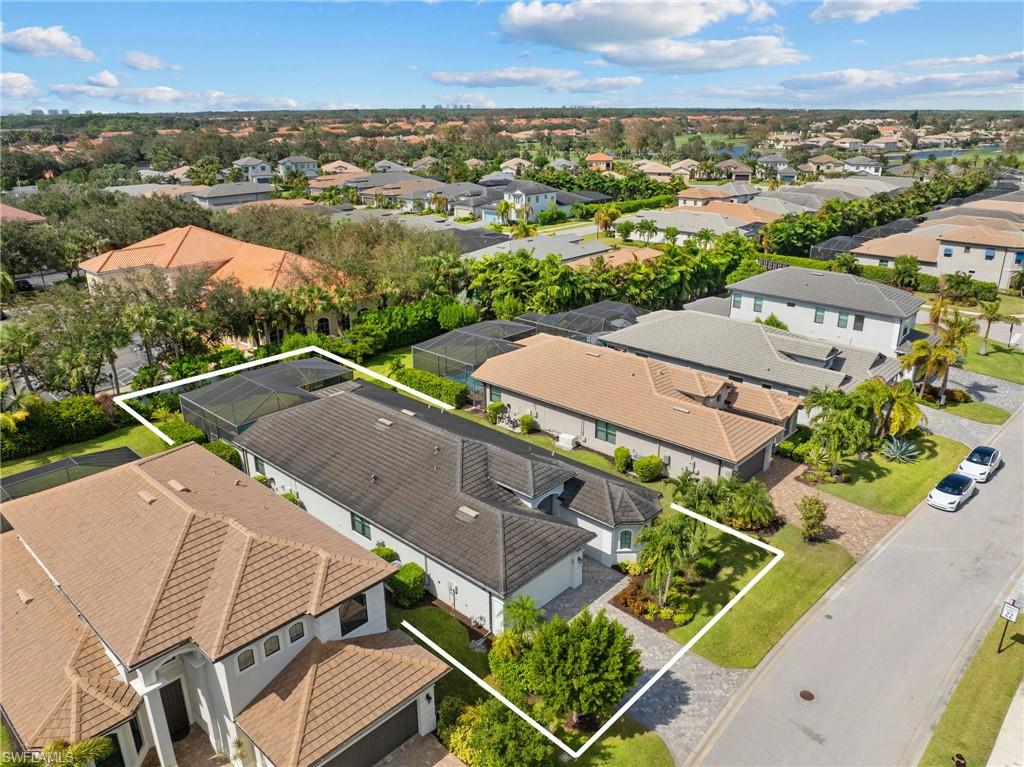10067 Palazzo Drive Naples, FL 34119 - Photo 44 of 46 an aerial view of a house with a garden