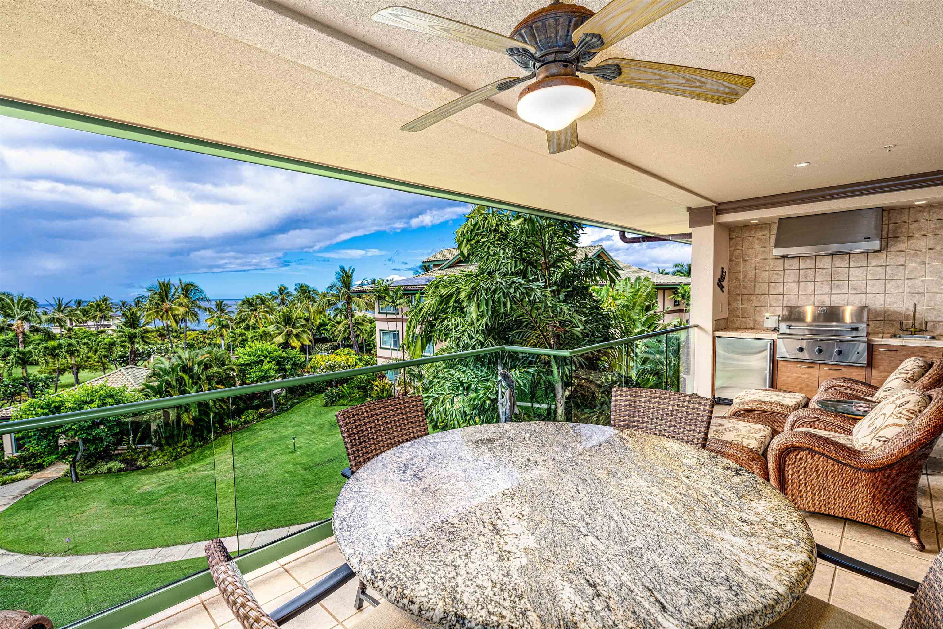 4955 Makena Road, Unit E301 Kihei, HI 96753 - Photo 14 of 22 a balcony with table and chairs