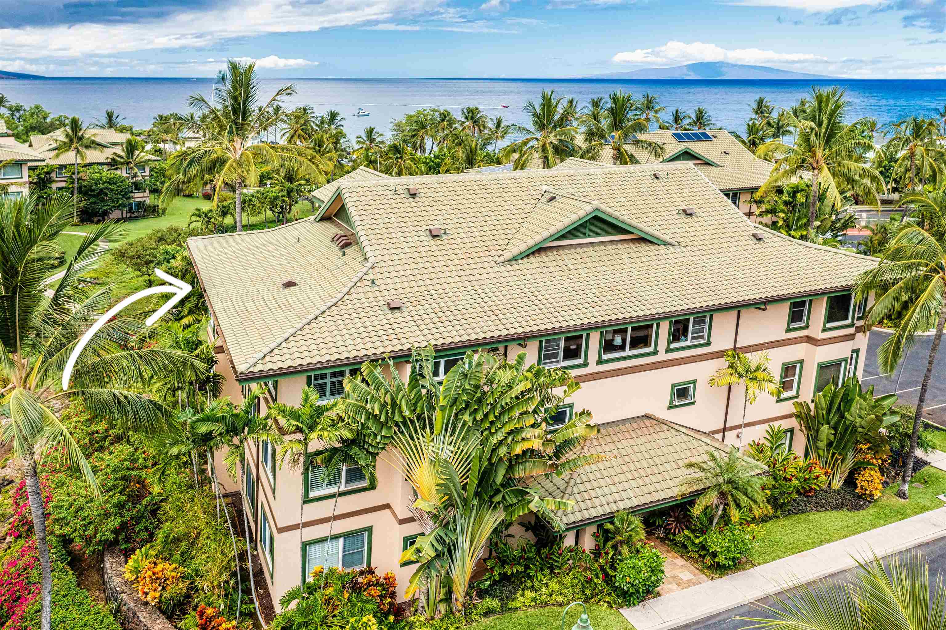 4955 Makena Road, Unit E301 Kihei, HI 96753 - Photo 2 of 22 a aerial view of a house with a yard and potted plants