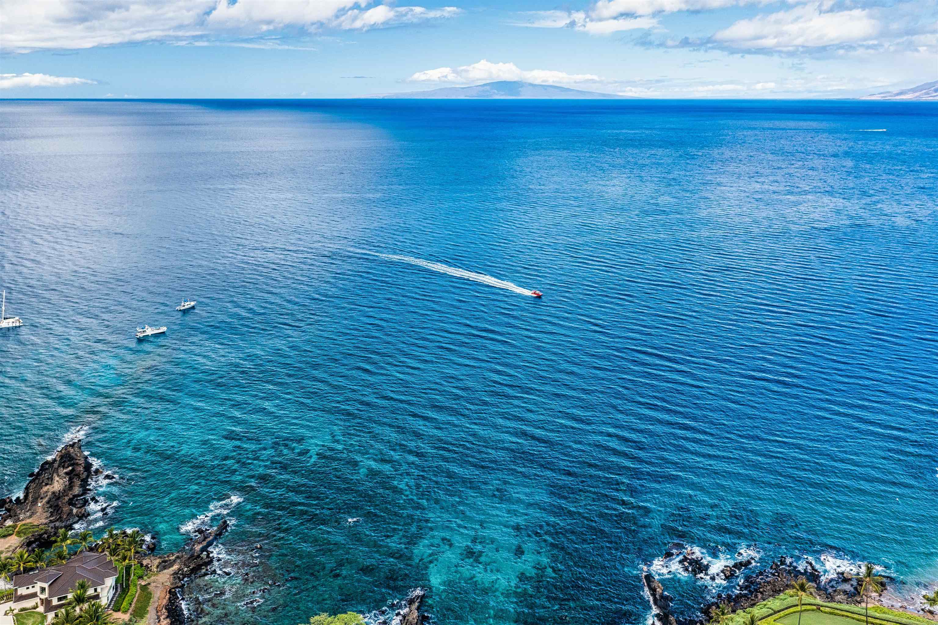 4955 Makena Road, Unit E301 Kihei, HI 96753 - Photo 22 of 22 a view of a room with an empty space and a wooden floor