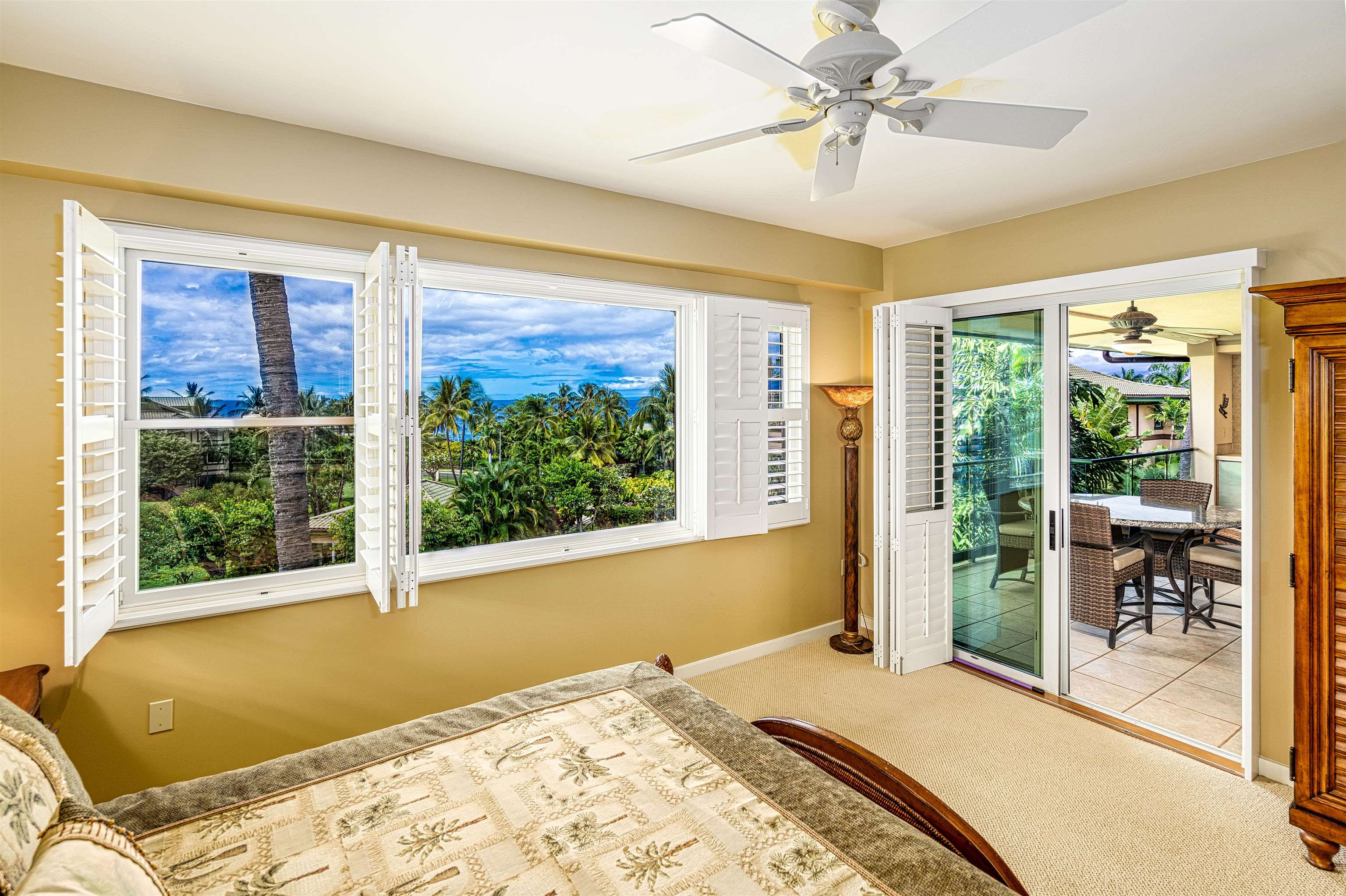 4955 Makena Road, Unit E301 Kihei, HI 96753 - Photo 8 of 22 a bedroom with a bed and large window with outer view