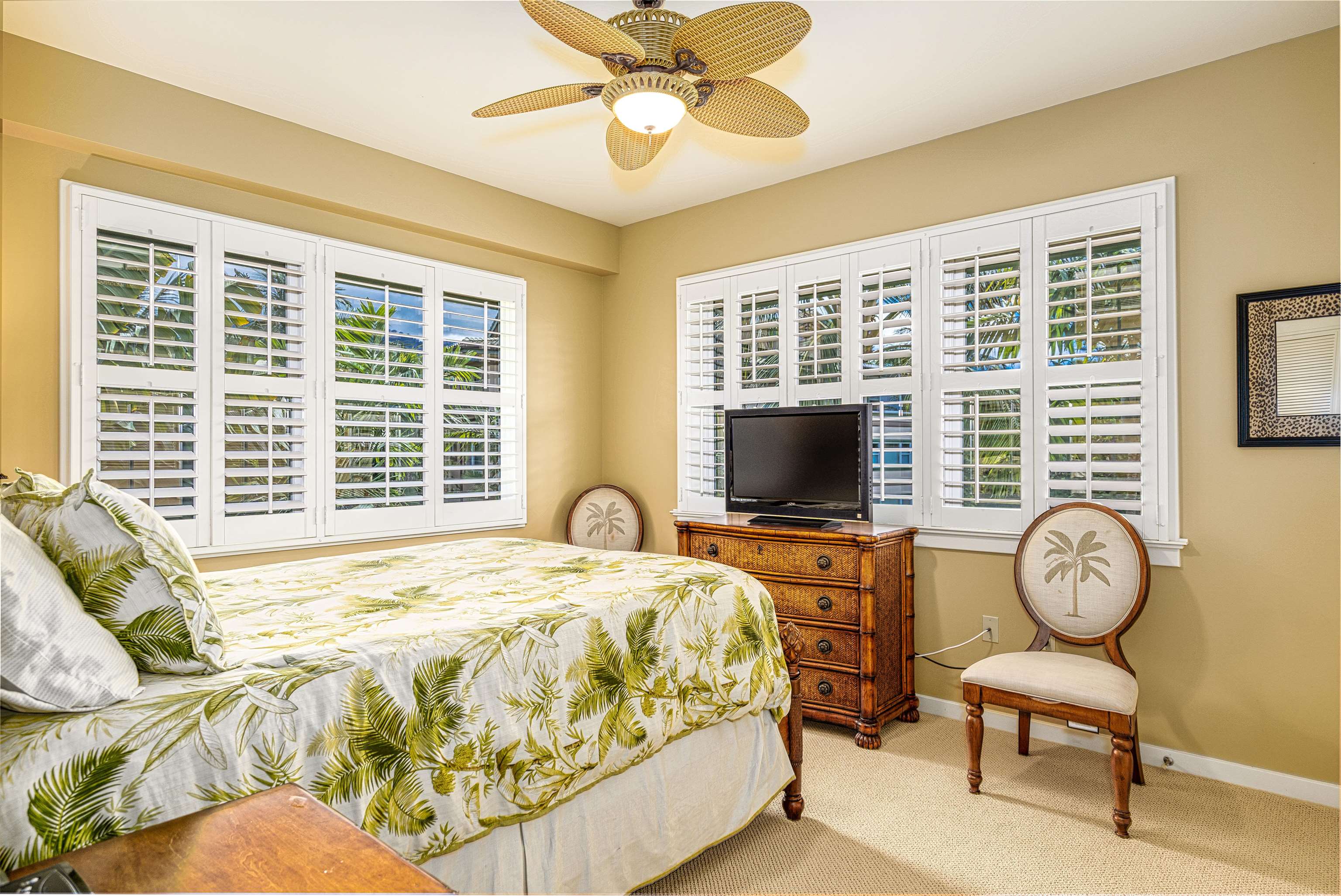 4955 Makena Road, Unit E301 Kihei, HI 96753 - Photo 9 of 22 a spacious bedroom with bed and a flat screen tv