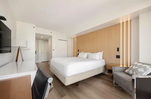 a bedroom with a bed and a couch